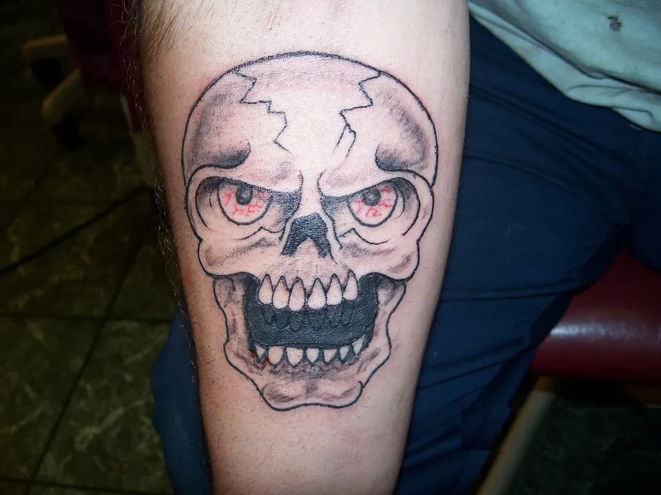 Skull tattoo used as a cover-up on the forearm
